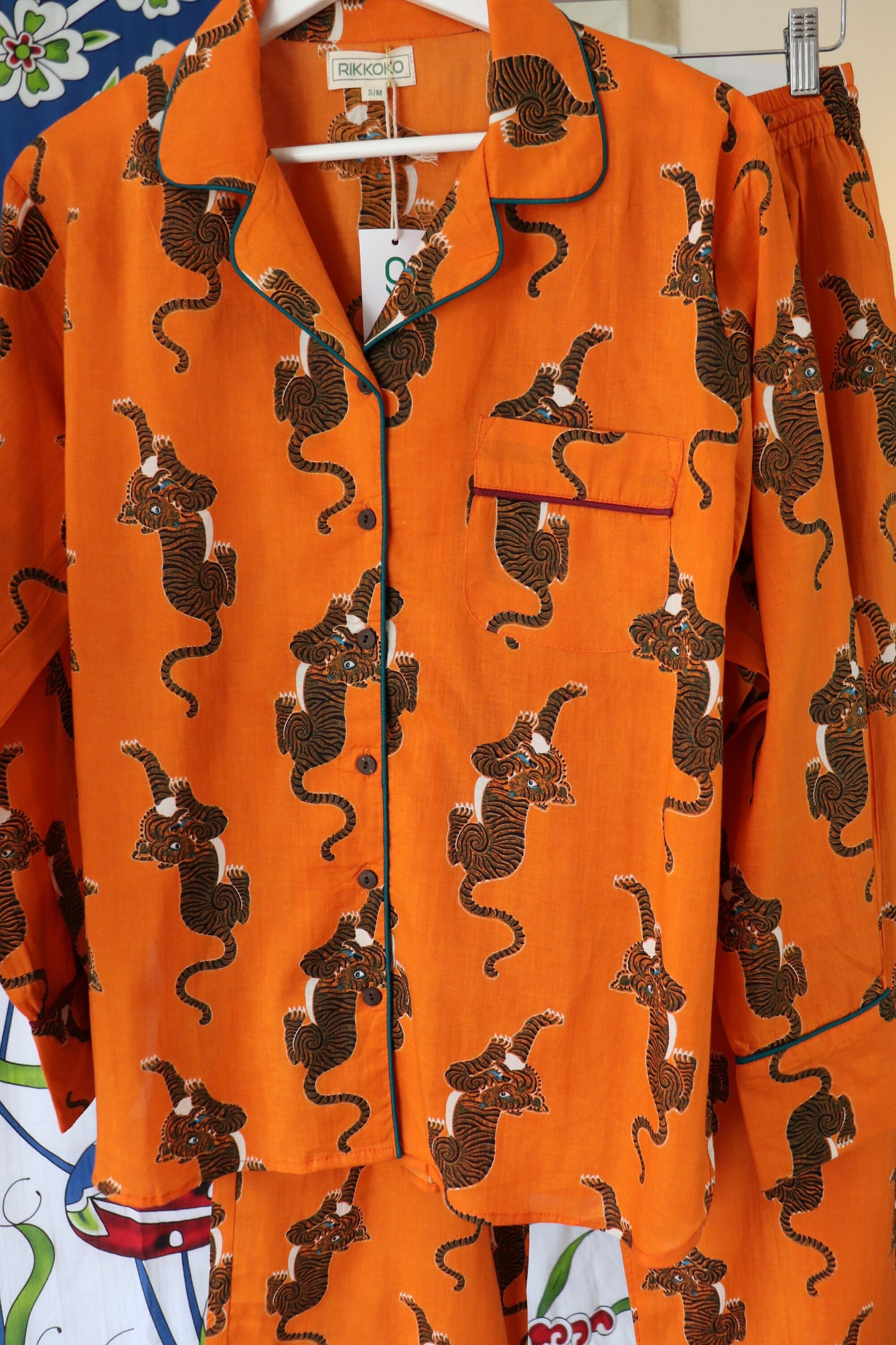 Pyjama set woman in pure cotton Tigers inspired print,  long pants and long sleeves with pockets and pipping on a Hermes Orange