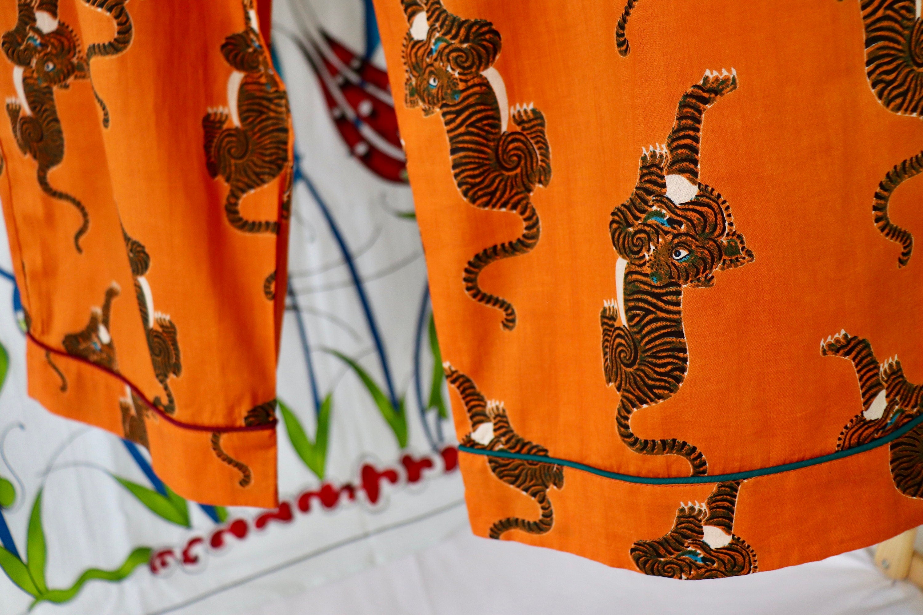 Pyjama set woman in pure cotton Tigers inspired print,  long pants and long sleeves with pockets and pipping on a Hermes Orange